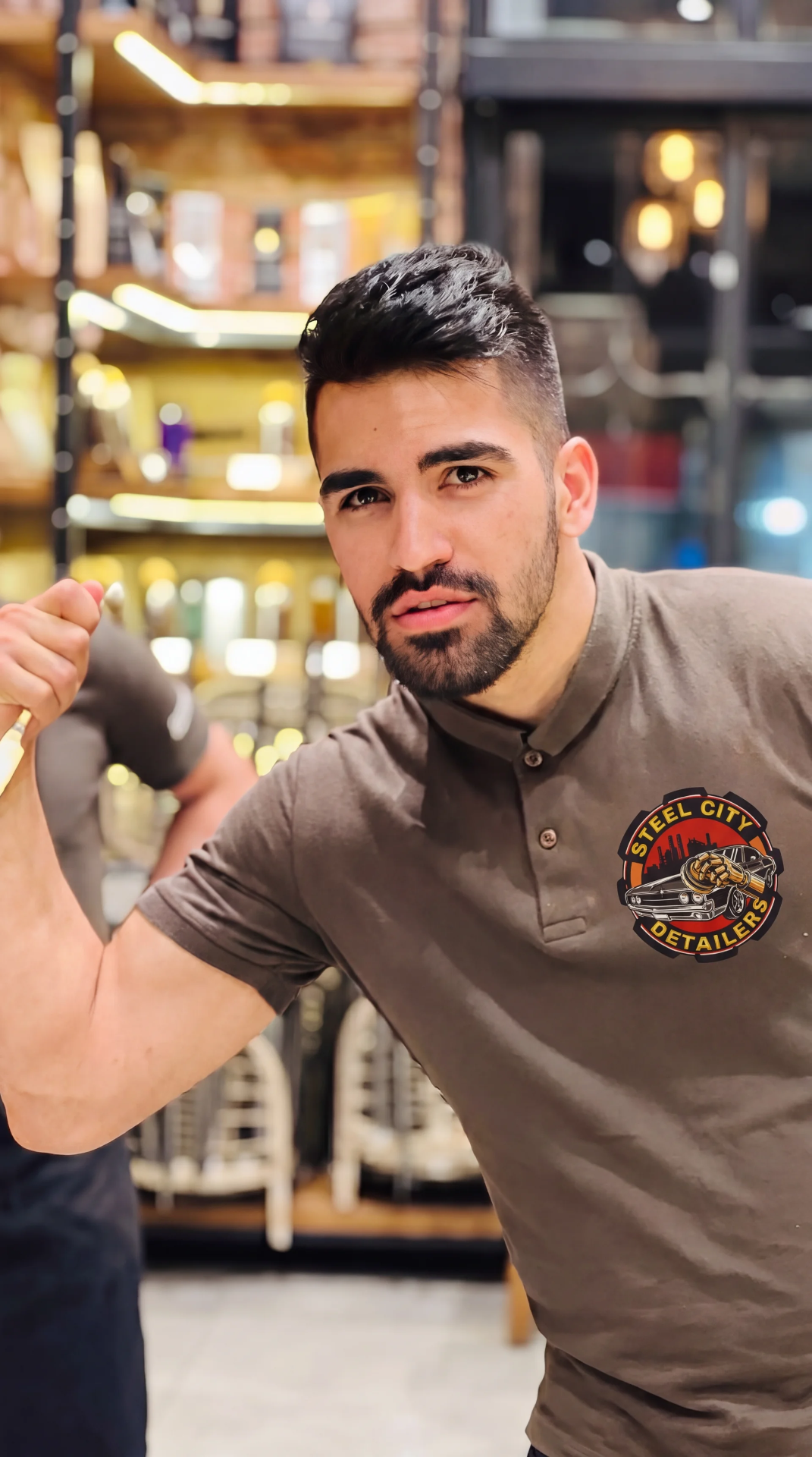 Murad, founder of Steel City Detailers, wearing a branded polo shirt